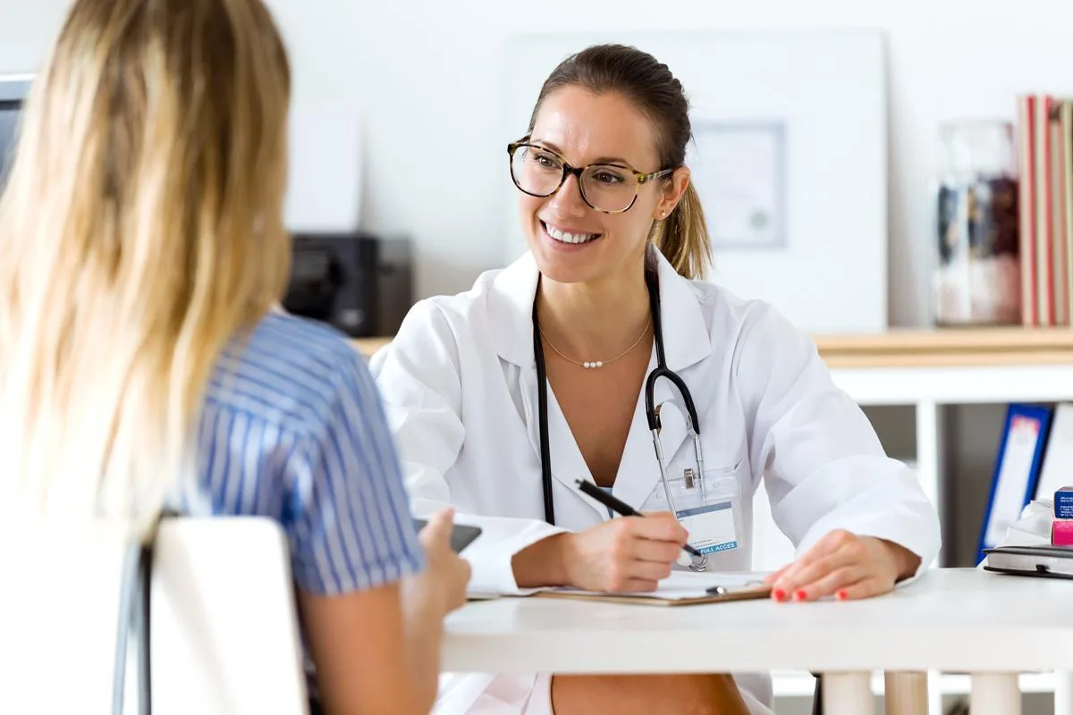 Clinicians coordinating same-day patient care in a bright clinic